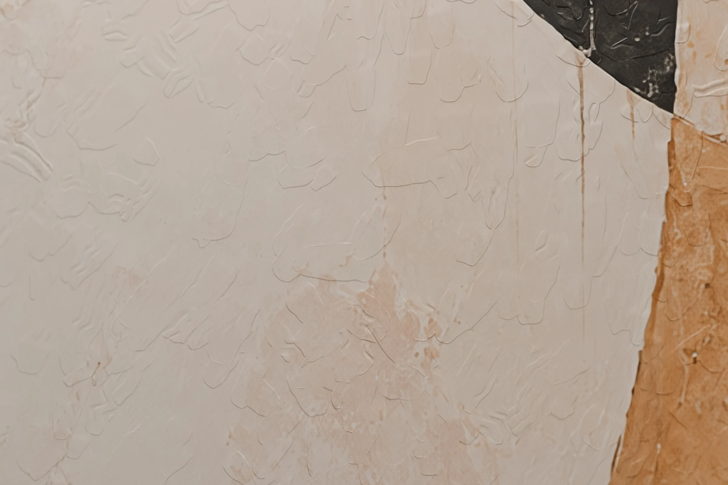Close-up of palette-knife ridges in cream and orange paint